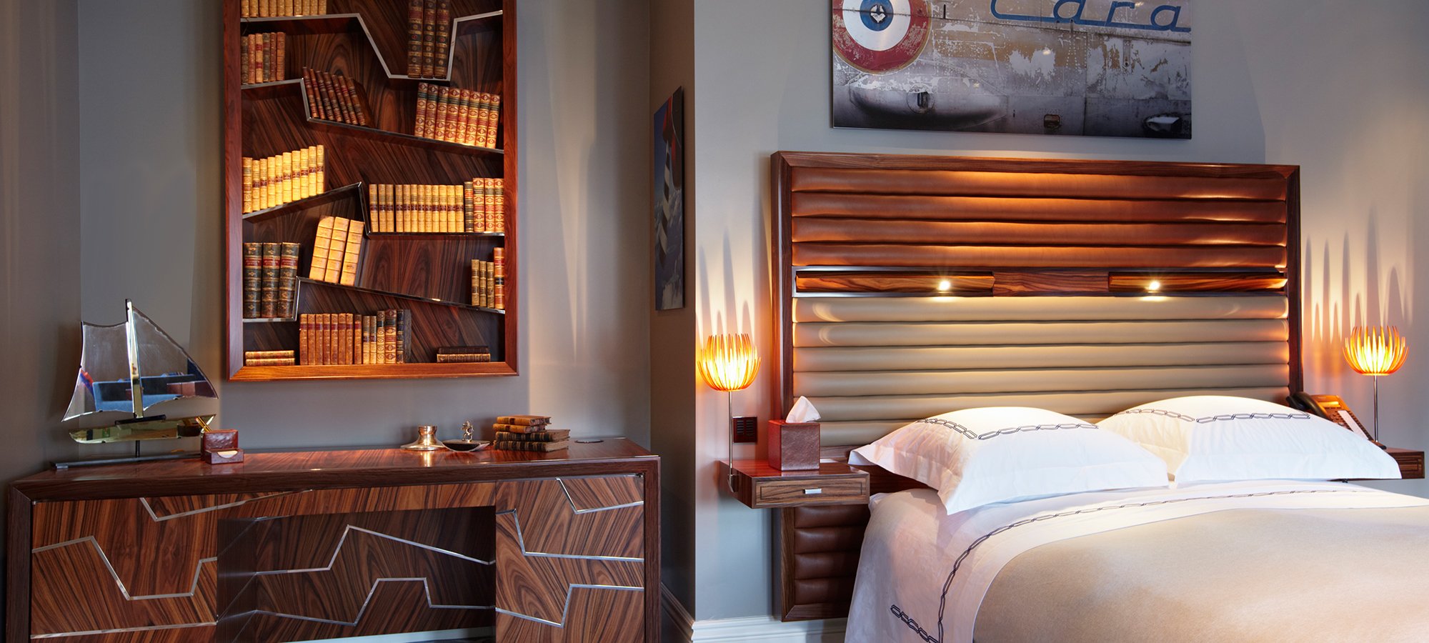A modern bedroom with Gosling geometric desk & bookcase, & illuminated headboard